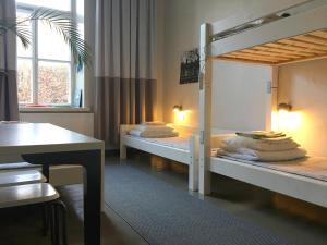Postel nebo postele na pokoji v ubytování Hostel Suomenlinna