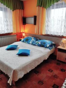 Posteľ alebo postele v izbe v ubytovaní Pokoje Gościnne Agusia