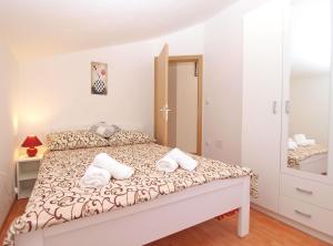 Posteľ alebo postele v izbe v ubytovaní Apartments Mala Vala 1332