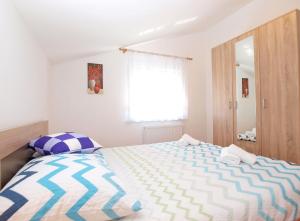 Posteľ alebo postele v izbe v ubytovaní Apartments Mala Vala 1332