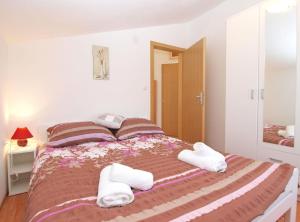 Posteľ alebo postele v izbe v ubytovaní Apartments Mala Vala 1332