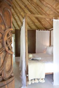 Ein Bett oder Betten in einem Zimmer der Unterkunft Hotel Les Cinq Djellabas