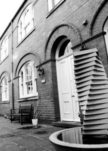 a building with a fountain in front of a building at Princes Dock Chambers 2 in Hull