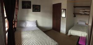 Postel nebo postele na pokoji v ubytování Fami Hotel Vive Jardin