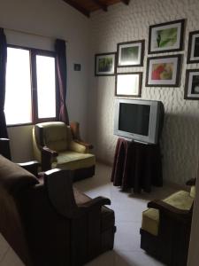 TV a/nebo společenská místnost v ubytování Fami Hotel Vive Jardin
