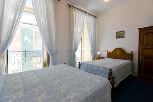 Кровать или кровати в номере Residencial Geres