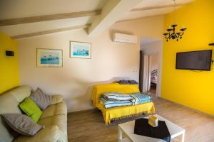 TV a/nebo společenská místnost v ubytování Holiday Home Fasana