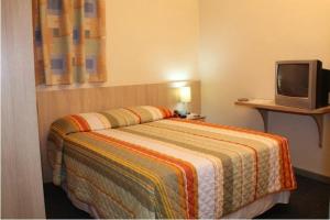 Cama o camas de una habitación en Euro Hotel