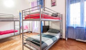 Posteľ alebo postele v izbe v ubytovaní Central Hostel Milano