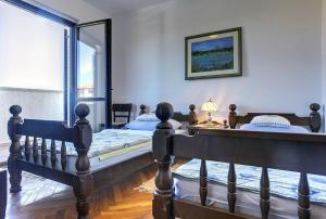 Postel nebo postele na pokoji v ubytování Villa Ruza