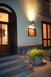 a room with stairs and a door and a plant at Al Corbezzolo in Torre del Greco