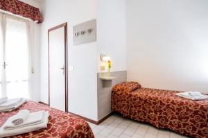 Postel nebo postele na pokoji v ubytování Hotel Belmar