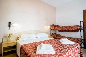 Postel nebo postele na pokoji v ubytování Hotel Belmar