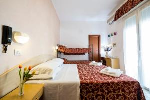 Postel nebo postele na pokoji v ubytování Hotel Belmar