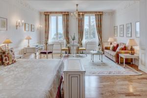 a bedroom with a bed and a living room at Splendido, A Belmond Hotel, Portofino in Portofino