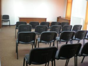 a group of chairs sitting in a room at Hotel Elit in Devin