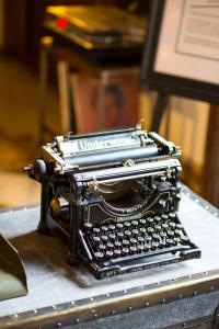 an old typewriter sitting on top of a table at Hotel Normandie - Los Angeles in Los Angeles