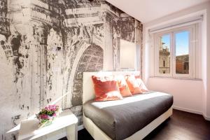 A bed or beds in a room at Albergo Abruzzi
