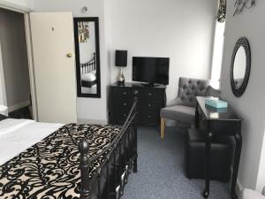 A television and/or entertainment center at Castle Lodge guest house 