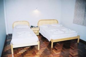 Postel nebo postele na pokoji v ubytování Hotel Topazio Ltda + 7 fotografií