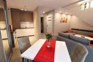Posedenie v ubytovaní Apartamenty BM'Kruk