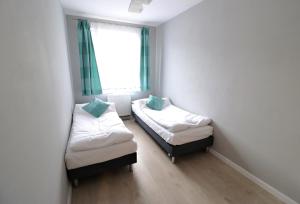 Posteľ alebo postele v izbe v ubytovaní Apartamenty BM'Kruk