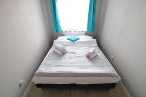 Posteľ alebo postele v izbe v ubytovaní Apartamenty BM'Kruk