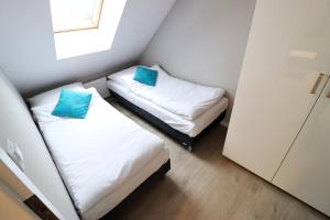 Postel nebo postele na pokoji v ubytování Apartamenty BM'Kruk