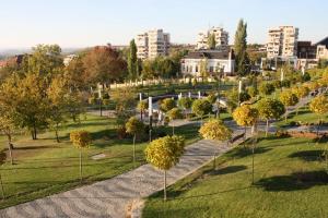 an aerial view of a park with trees and buildings at Hotel Bulevard Prestige in Slatina