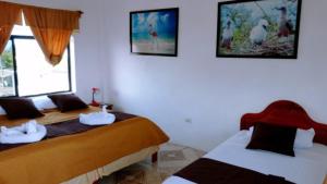 Voodi või voodid majutusasutuse Hostal Sandrita toas