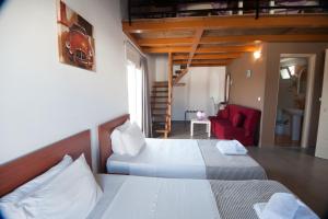 Ένα ή περισσότερα κρεβάτια σε δωμάτιο στο Elounda Sunrise Apartments 