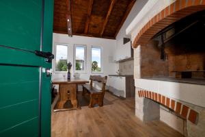 a kitchen with a table and a dining room at Villa Lily in Privlaka