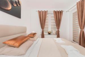 Posteľ alebo postele v izbe v ubytovaní Grace Apartment I