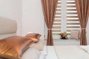 Posteľ alebo postele v izbe v ubytovaní Grace Apartment I