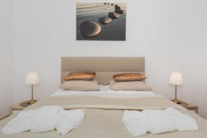 Posteľ alebo postele v izbe v ubytovaní Grace Apartment I
