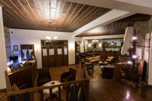 a large living room with a wooden ceiling at Hotel Ligeri in Elati Trikalon