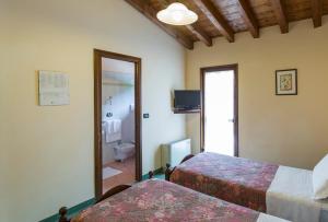 Postel nebo postele na pokoji v ubytování Hotel Conca Verde + 37 fotografií