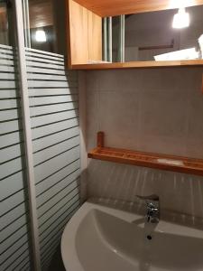 a bathroom with a sink and a mirror at Casa Vacanza Isola in Orta San Giulio