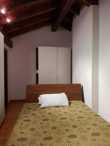 En eller flere senge i et værelse på Casa Vacanza Isola
