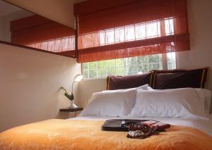 מיטה או מיטות בחדר ב-6 Suites Hotel