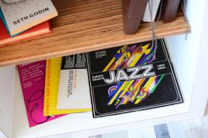 a pile of zza games on a shelf at Jazzy Sofia Downtown Apartment in Sofia