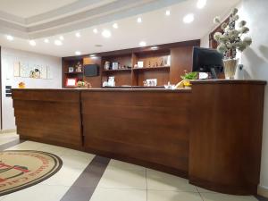 a lobby with a reception desk in a building at Hotel Santa Caterina in Fisciano