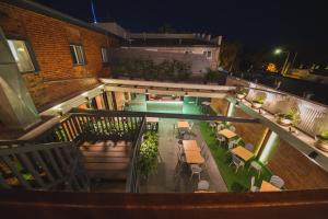an overhead view of a balcony with tables and chairs at Heritage Hotel Rockhampton in Rockhampton