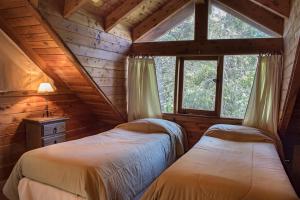 เตียงในห้องที่ Patagonia Sin Fronteras