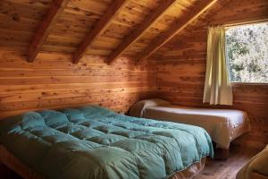 Postel nebo postele na pokoji v ubytování Patagonia Sin Fronteras