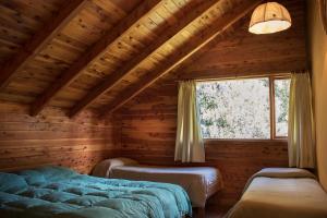 Postel nebo postele na pokoji v ubytování Patagonia Sin Fronteras