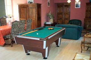 a living room with a pool table in it at Hôtel Doussière - Restaurant l'Alicanta in Le Rozier