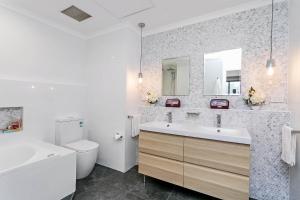 
A bathroom at Heart of Glenelg BnB
