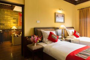 Postelja oz. postelje v sobi nastanitve Hotel Tibet International