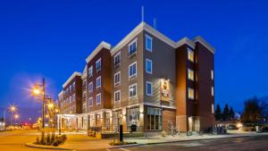 a large building on a city street at night at Best Western Plus Chateau Inn Sylvan Lake in Sylvan Lake
